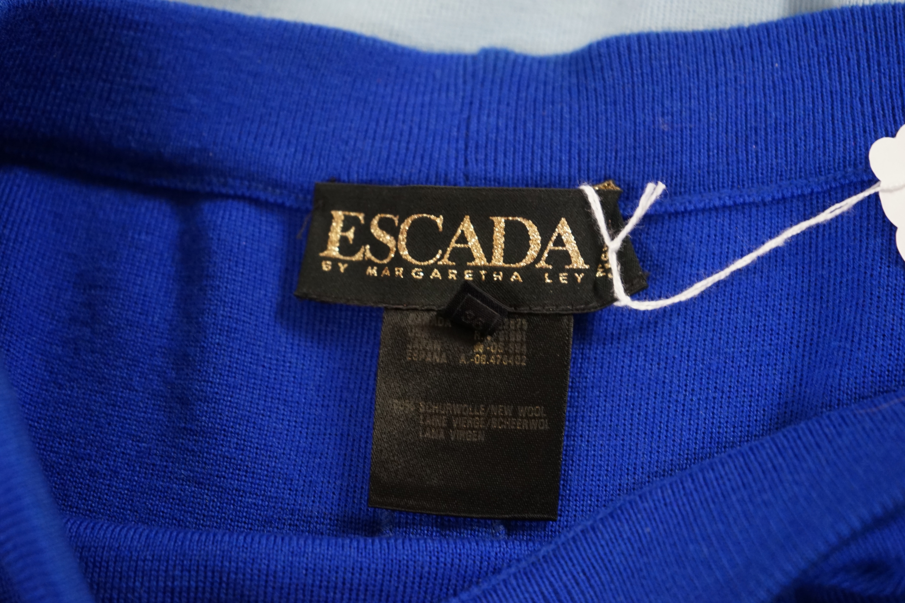 Two Escada knitted skirts. Proceeds to Happy Paws Puppy Rescue